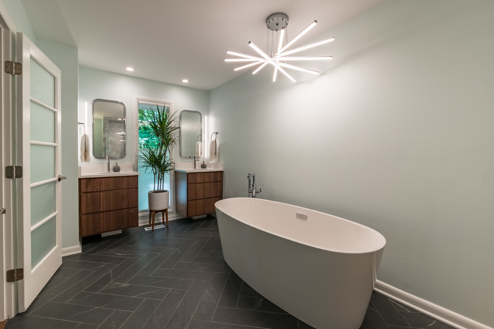 Example of a mid-century modern bathroom design in Raleigh