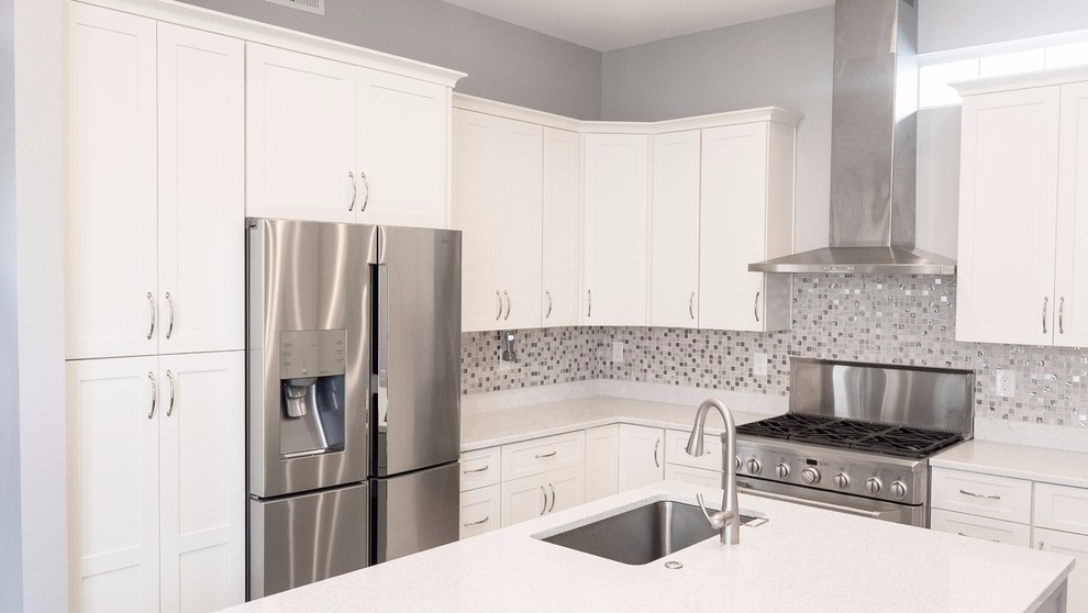 Inspiration for a large modern u-shaped porcelain tile and white floor eat-in kitchen remodel with an undermount sink, flat-panel cabinets, white cabinets, quartzite countertops, multicolored backsplash, subway tile backsplash, stainless steel appliances, an island and multicolored countertops