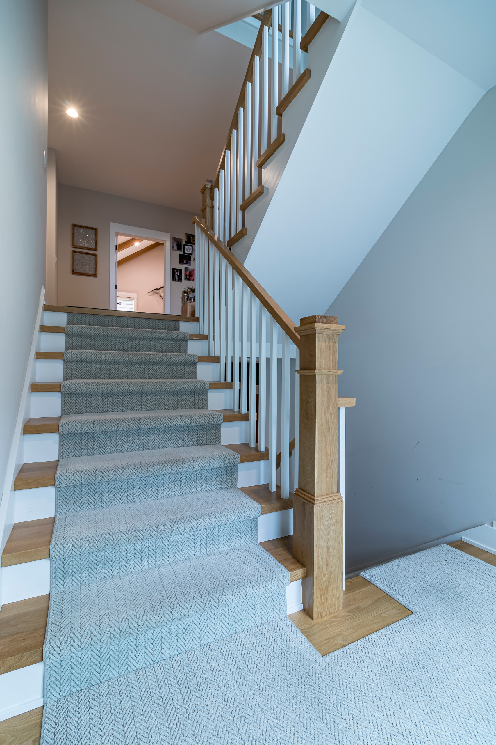 Example of a cottage wooden straight wood railing and wainscoting staircase design in Chicago with wooden risers