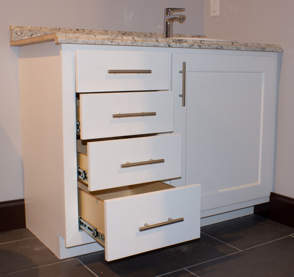 Inspiration for a mid-sized transitional single-wall medium tone wood floor and brown floor eat-in kitchen remodel with an undermount sink, shaker cabinets, white cabinets, granite countertops, stainless steel appliances and an island