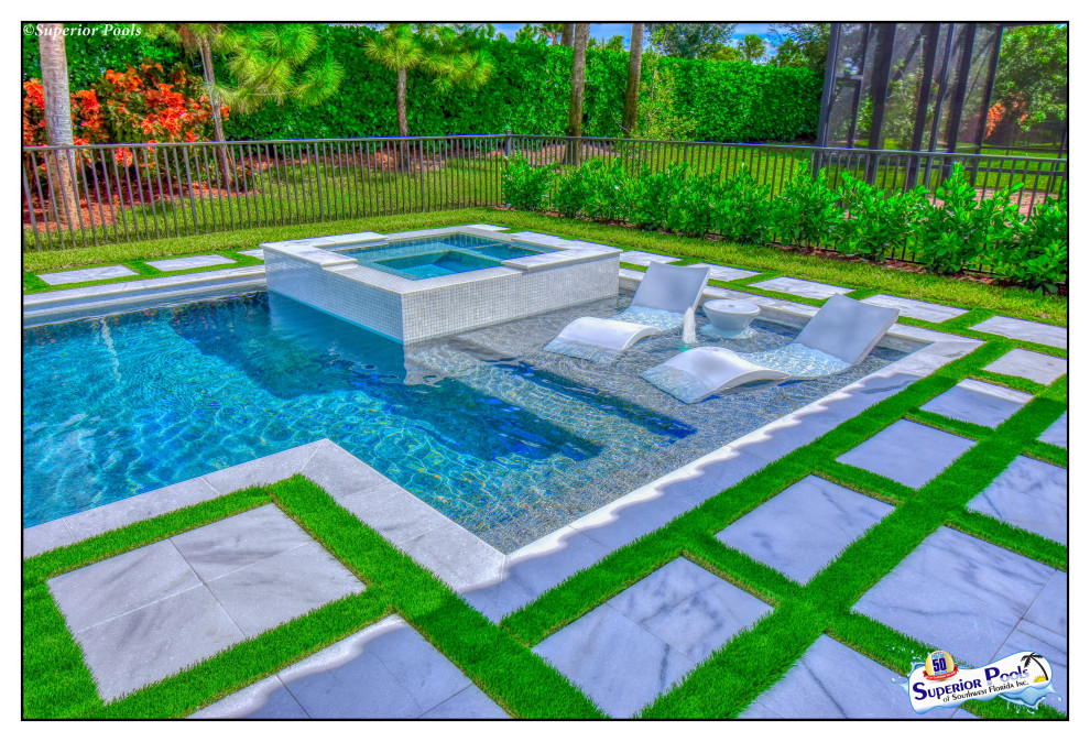 Design ideas for a mid-sized modern courtyard custom-shaped natural pool in Tampa with a pool house and decking.