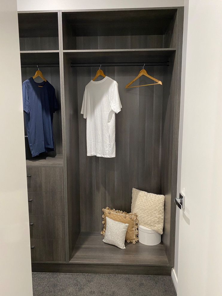 Inspiration for a large contemporary gender-neutral walk-in wardrobe in Adelaide with carpet and grey floor.