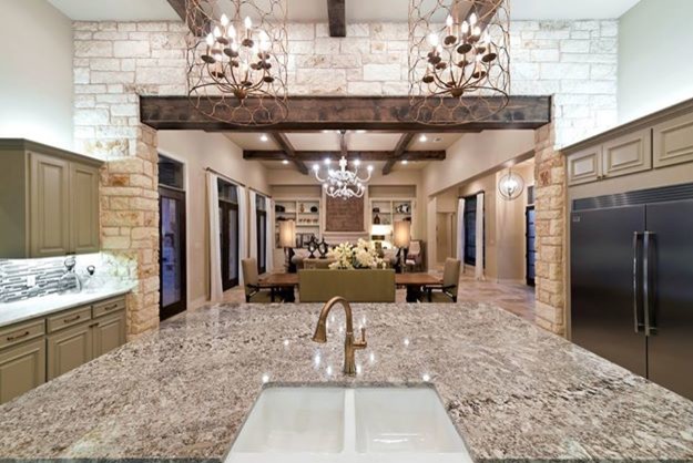 Design ideas for a transitional u-shaped eat-in kitchen in Austin with a farmhouse sink, raised-panel cabinets, grey cabinets, marble benchtops, multi-coloured splashback, glass tile splashback, stainless steel appliances, travertine floors and with island.