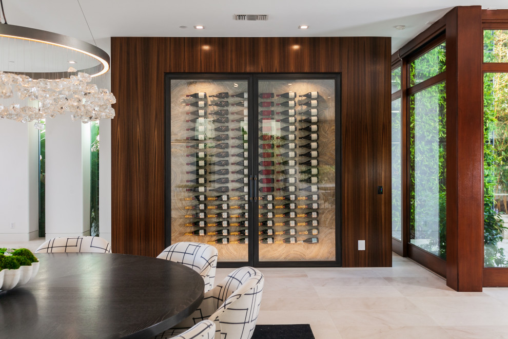 Inspiration for a mid-sized contemporary wine cellar in Orange County with porcelain floors, display racks and beige floor.