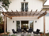 Farmhouse Patio by Edgewood Builders, Inc