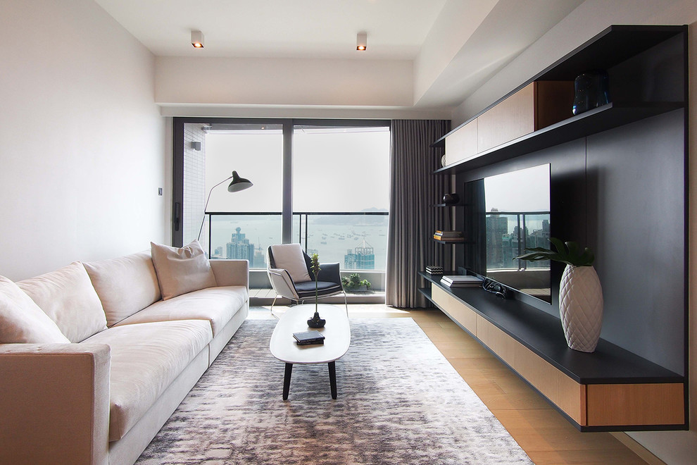 Design ideas for a transitional living room in Hong Kong with white walls, medium hardwood floors and brown floor.