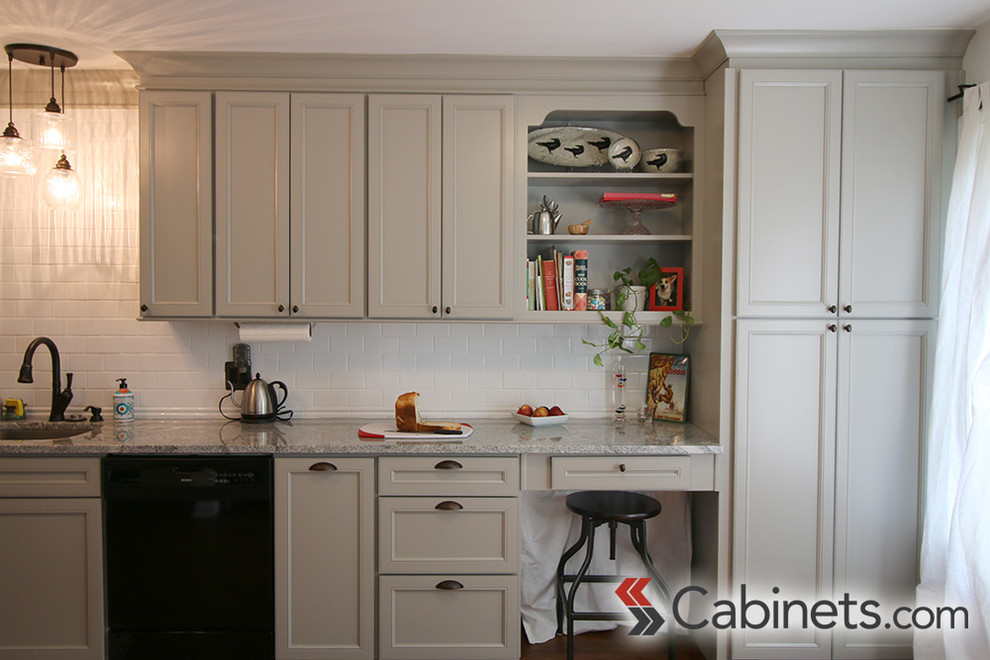 Kitchen - transitional medium tone wood floor kitchen idea in Tampa with a drop-in sink, flat-panel cabinets, gray cabinets, white backsplash, subway tile backsplash, stainless steel appliances and no island