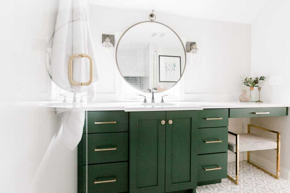 Example of a mid-sized transitional master white tile and porcelain tile porcelain tile and white floor alcove bathtub design with shaker cabinets, green cabinets, gray walls, an undermount sink, quartz countertops, a hinged shower door and white countertops