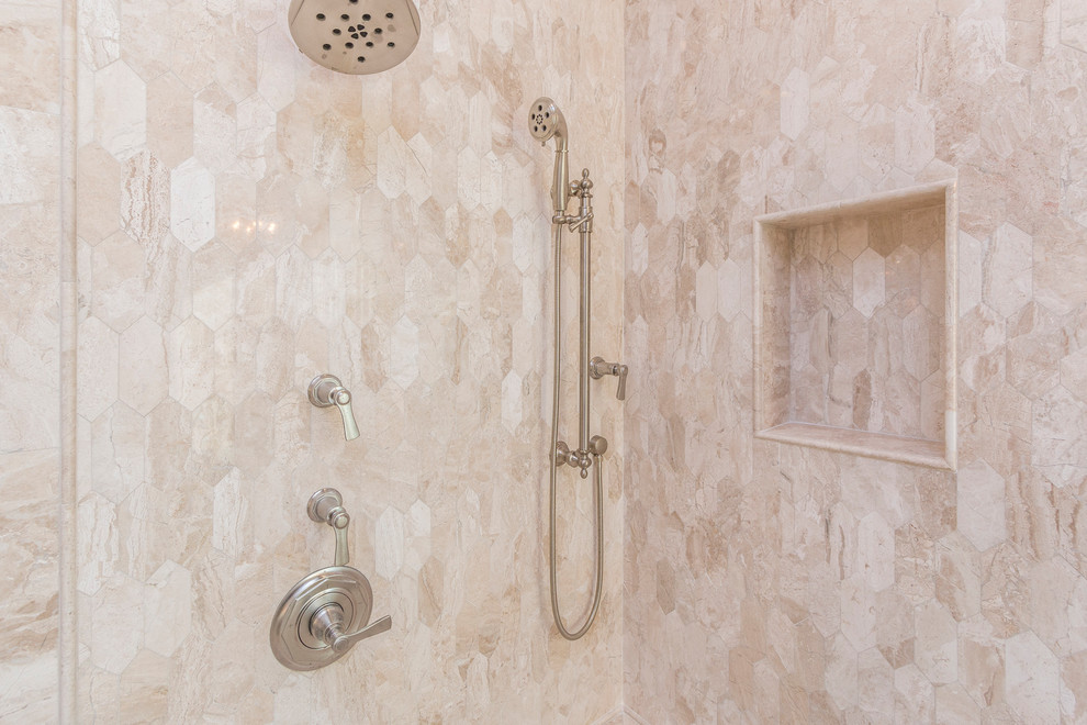 Inspiration for an expansive transitional master bathroom in Phoenix with raised-panel cabinets, beige cabinets, a freestanding tub, a corner shower, a one-piece toilet, beige tile, marble, grey walls, an undermount sink, marble benchtops and a hinged shower door.