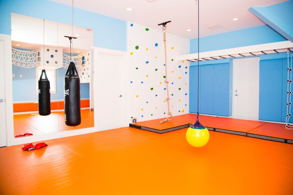 Mid-sized contemporary gender-neutral kids' playroom in New York with blue walls and orange floor for kids 4-10 years old.