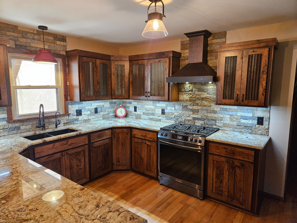 Photo of a medium sized rustic u-shaped kitchen/diner in Nashville with dark wood cabinets and granite worktops.