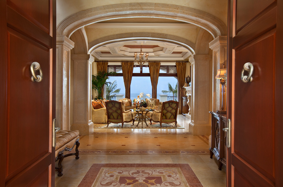 Large mediterranean foyer in Miami with a double front door and a medium wood front door.