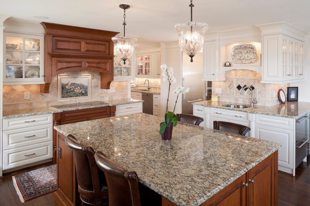 Photo of a traditional kitchen in Cincinnati with glass-front cabinets and granite benchtops.