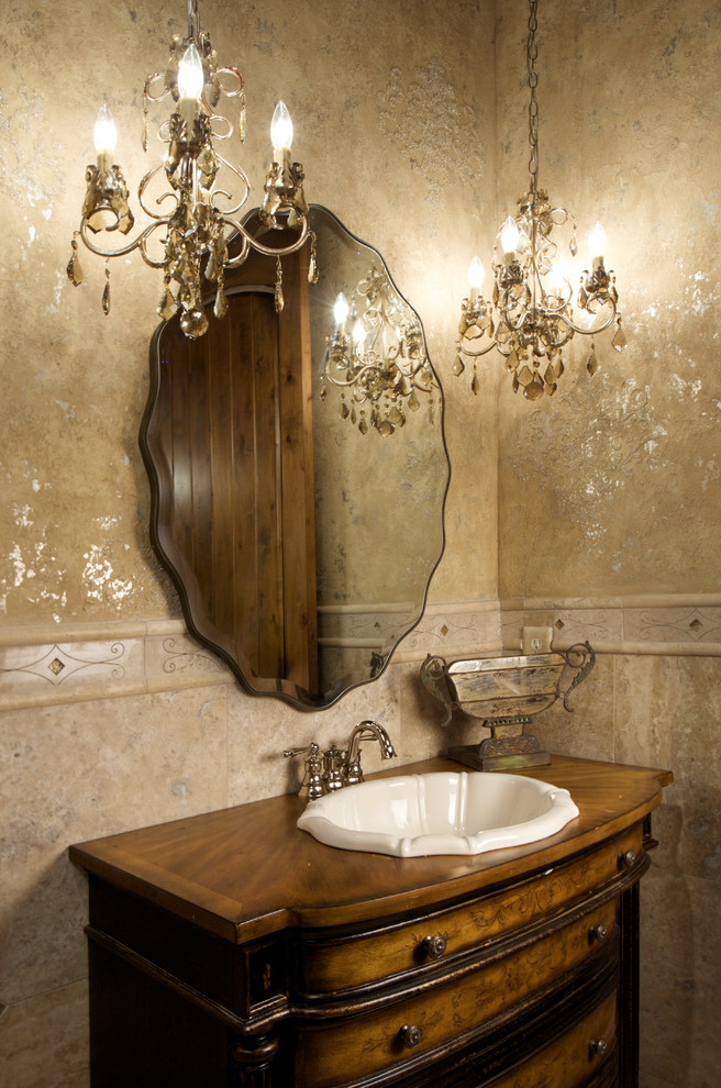 Design ideas for a traditional powder room in Kansas City with a drop-in sink, furniture-like cabinets, medium wood cabinets, wood benchtops, beige tile and brown benchtops.