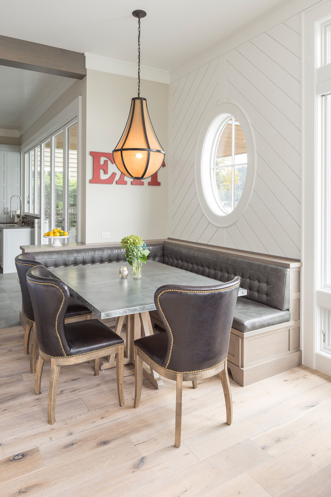 Transitional dining room in Portland with white walls, light hardwood floors and beige floor.