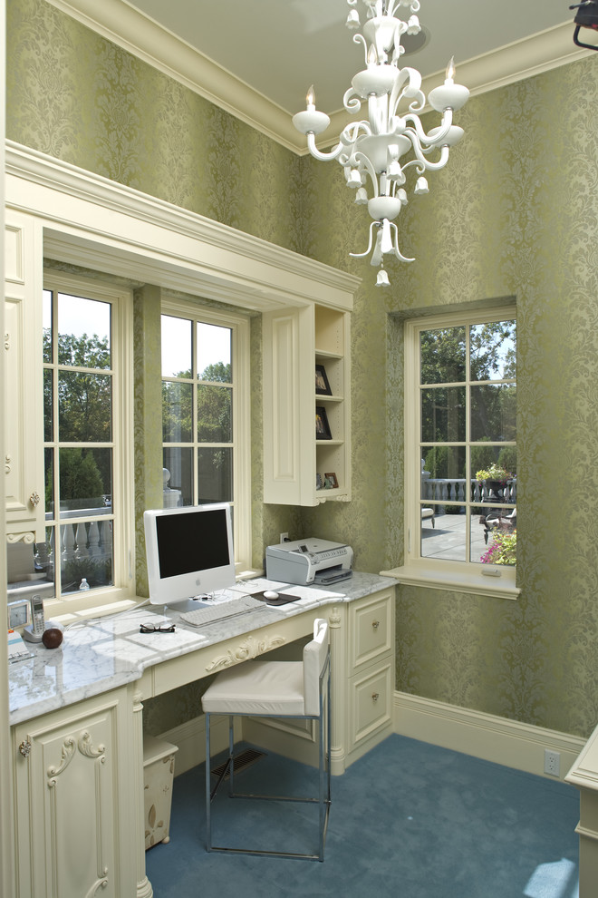 This is an example of a mediterranean home office in Minneapolis with a built-in desk.