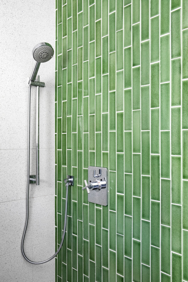 This is an example of a mid-sized contemporary master bathroom in Orange County with an alcove shower, green tile, subway tile, cement tiles, grey floor and a hinged shower door.