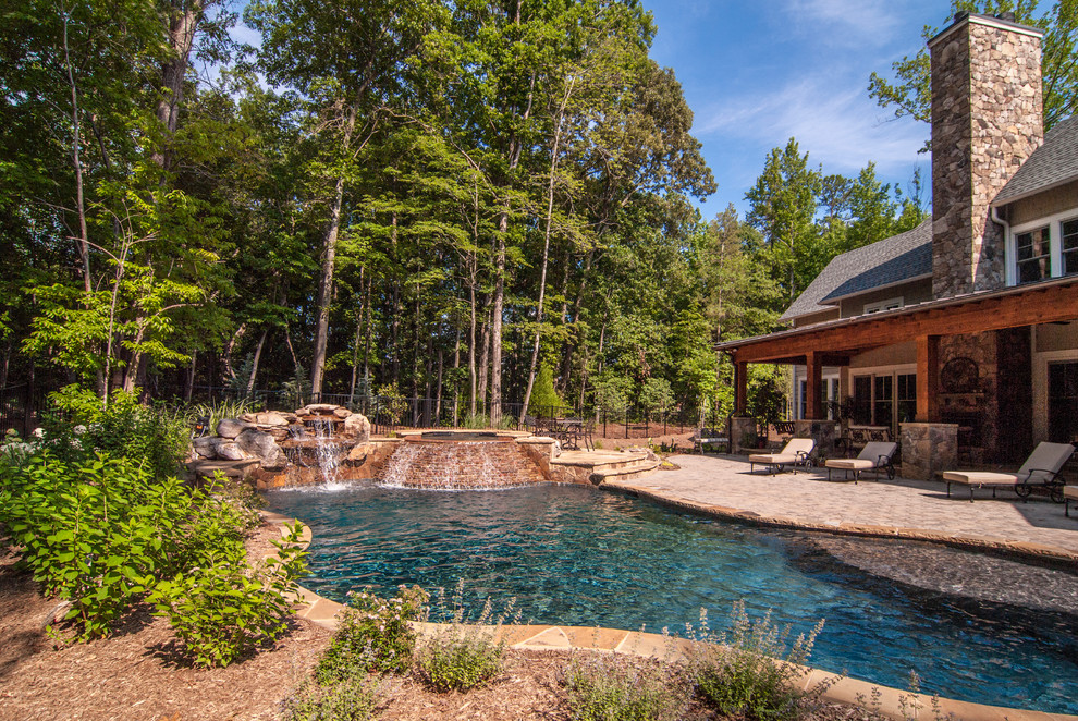 Inspiration for a traditional custom-shaped pool in Charlotte.