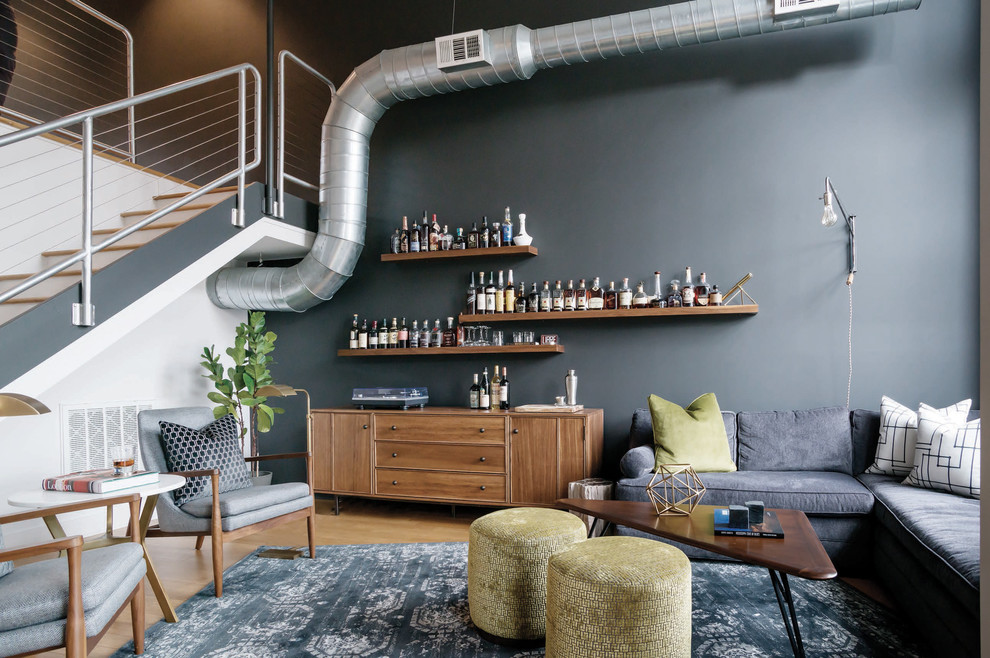 Inspiration for a mid-sized midcentury loft-style living room in Nashville with a home bar, black walls, bamboo floors, no fireplace and no tv.