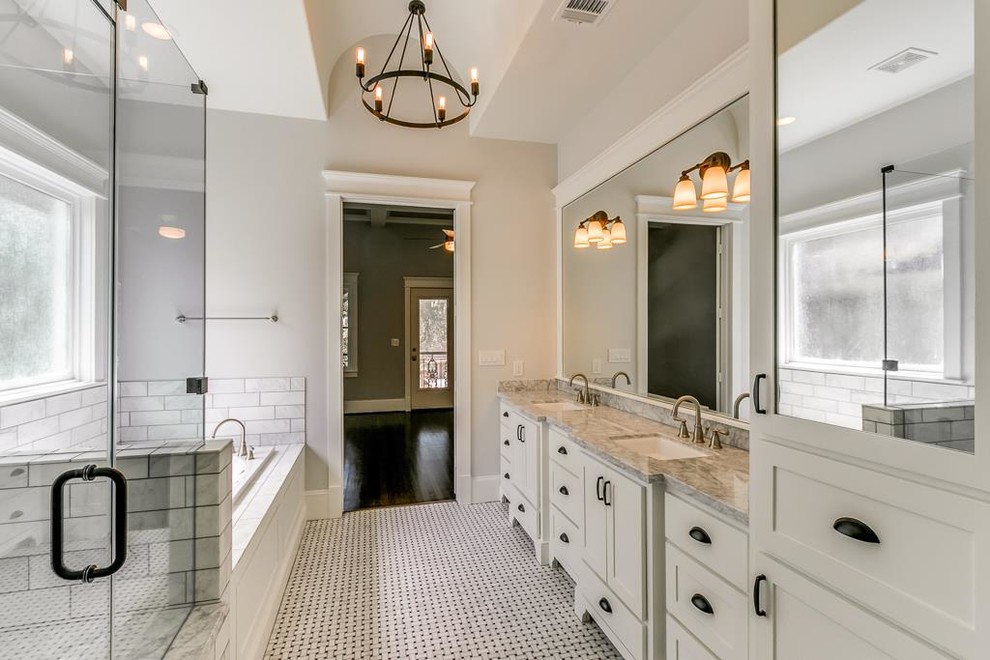 Design ideas for a mid-sized arts and crafts master bathroom in Houston with flat-panel cabinets, white cabinets, a hot tub, a shower/bathtub combo, a two-piece toilet, white walls, marble floors, an undermount sink, marble benchtops, white floor and a hinged shower door.