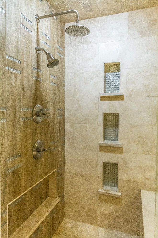 This is an example of a small contemporary master bathroom in Houston with a vessel sink, furniture-like cabinets, beige cabinets, granite benchtops, a corner shower, a two-piece toilet, beige tile, stone tile, green walls and travertine floors.