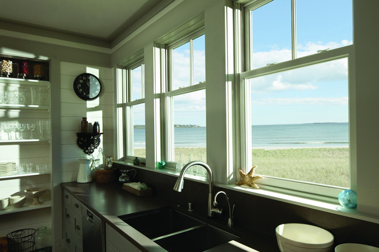 Inspiration for a mid-sized beach style kitchen in Toronto with an undermount sink, open cabinets, white cabinets, soapstone benchtops and stainless steel appliances.