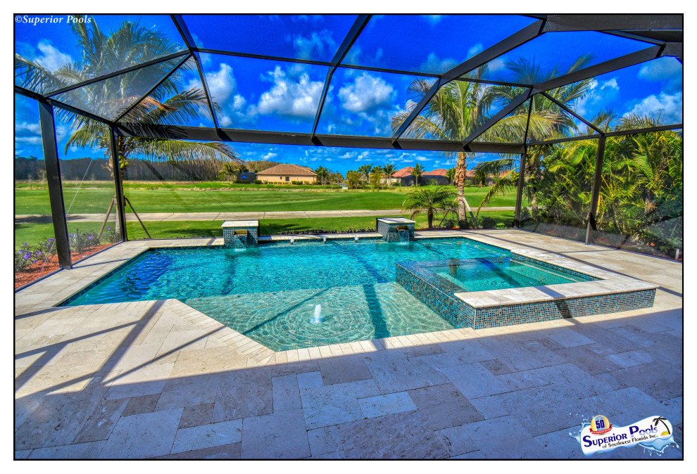 Mid-sized traditional backyard rectangular pool in Tampa with a water feature and natural stone pavers.