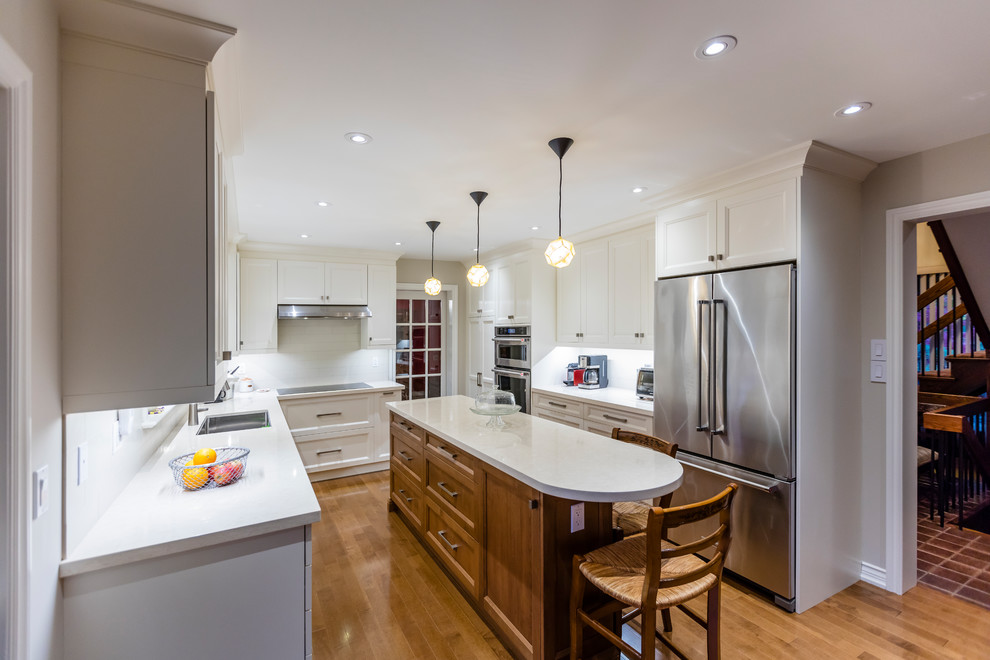 Example of a transitional kitchen design in Toronto