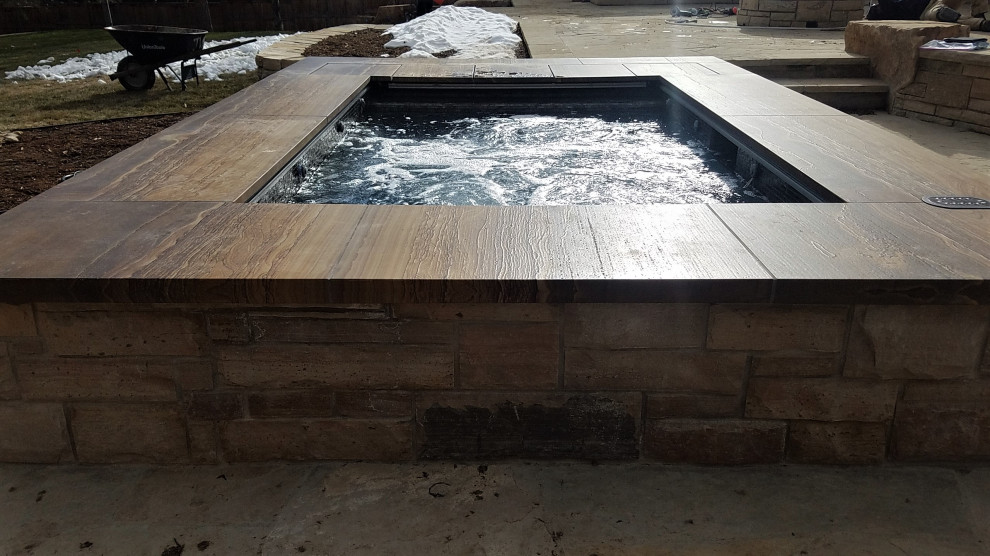 Inspiration for a small backyard rectangular aboveground hot tub remodel in Denver