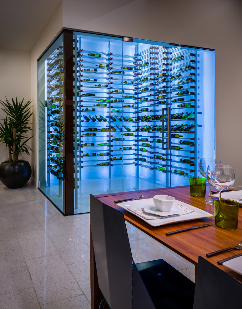 Design ideas for a mid-sized midcentury wine cellar in Los Angeles with storage racks.