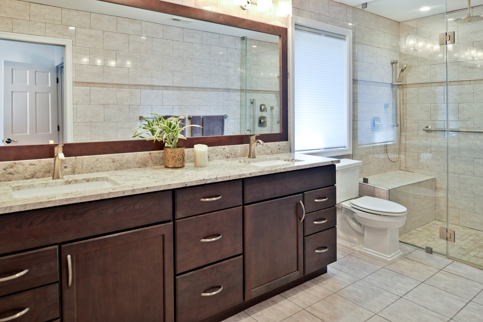 Example of a huge minimalist master beige tile beige floor tub/shower combo design in DC Metro with dark wood cabinets, a hot tub, a one-piece toilet, beige walls, an undermount sink and gray countertops