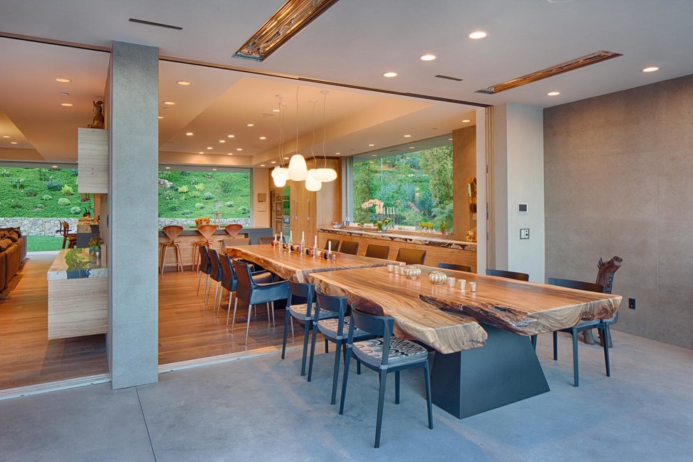 This is an example of a large contemporary kitchen/dining combo in San Diego with grey walls and light hardwood floors.