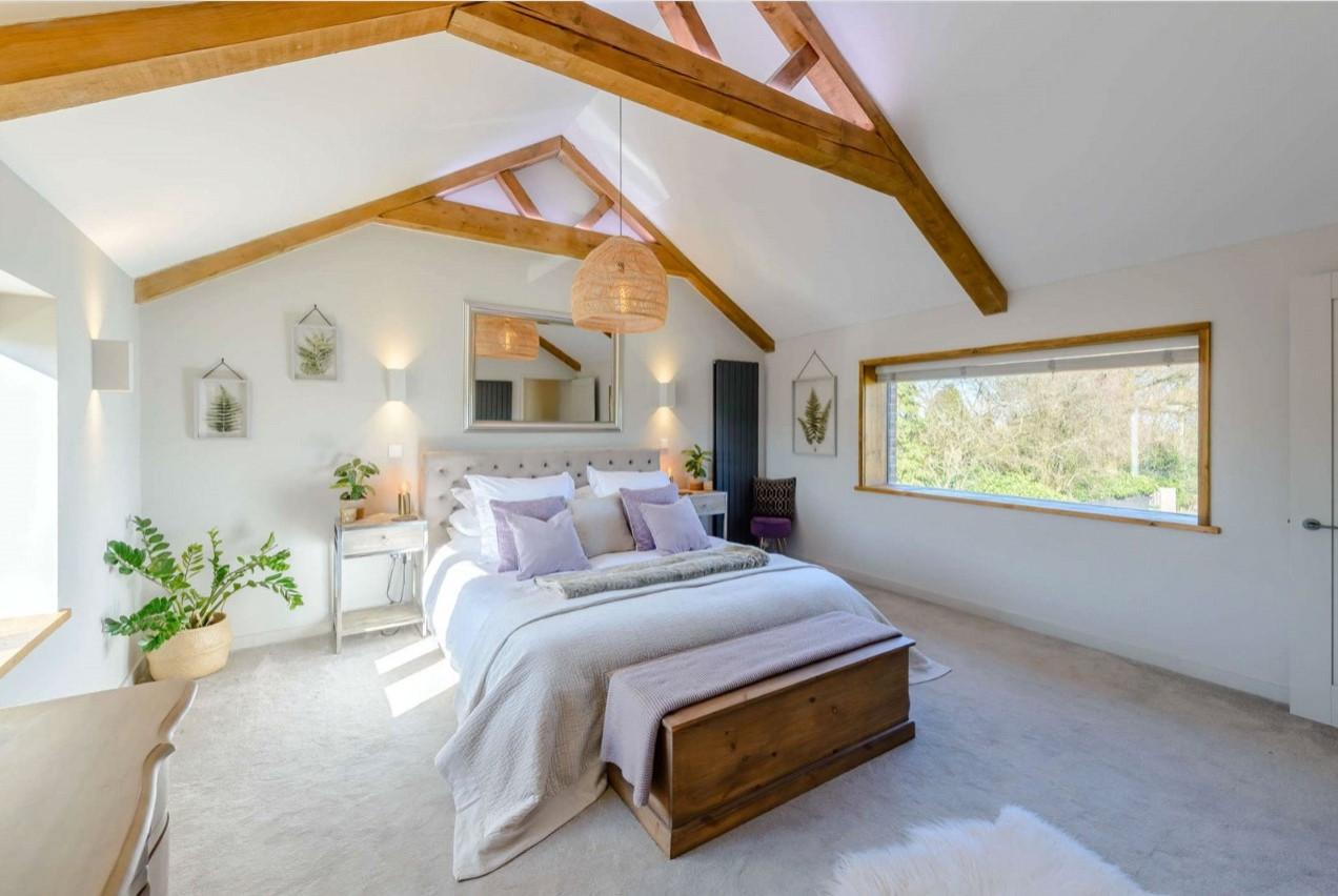 Master bedroom with vaulted ceiling