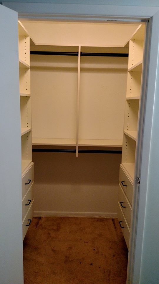 Photo of a mid-sized contemporary walk-in wardrobe in Other with flat-panel cabinets and beige cabinets.