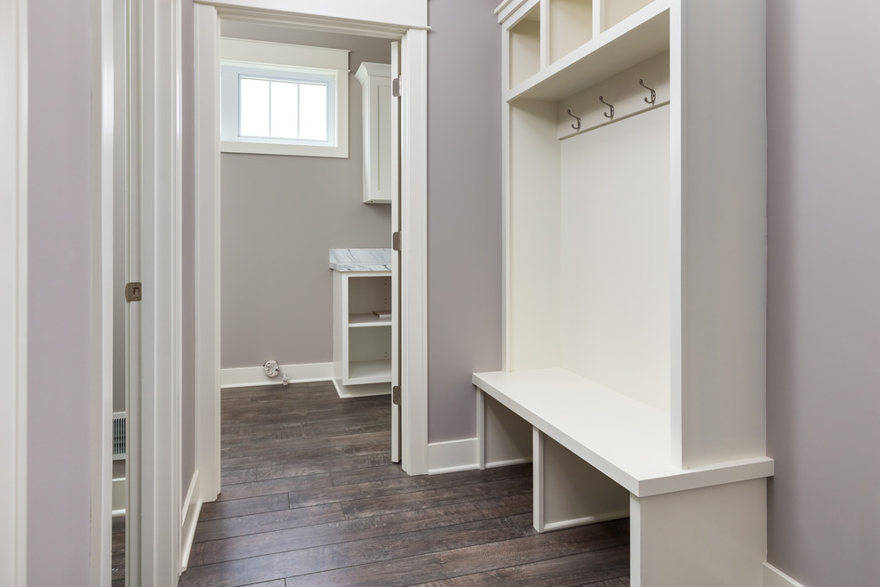Mid-sized arts and crafts mudroom in Grand Rapids with a single front door, a white front door, grey walls, vinyl floors and multi-coloured floor.