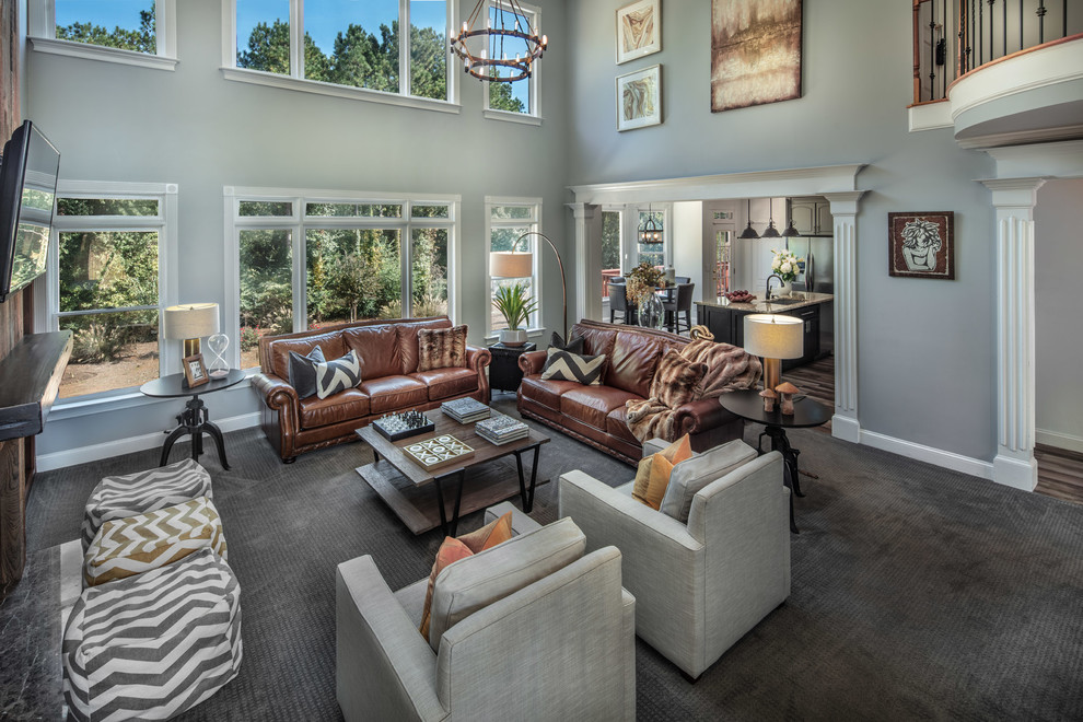 Large country open concept family room in Atlanta with grey walls, carpet, a standard fireplace, a built-in media wall, grey floor, wood walls and a stone fireplace surround.