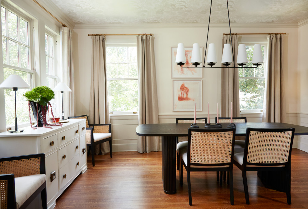 Medium sized traditional enclosed dining room in Atlanta with beige walls and medium hardwood flooring.