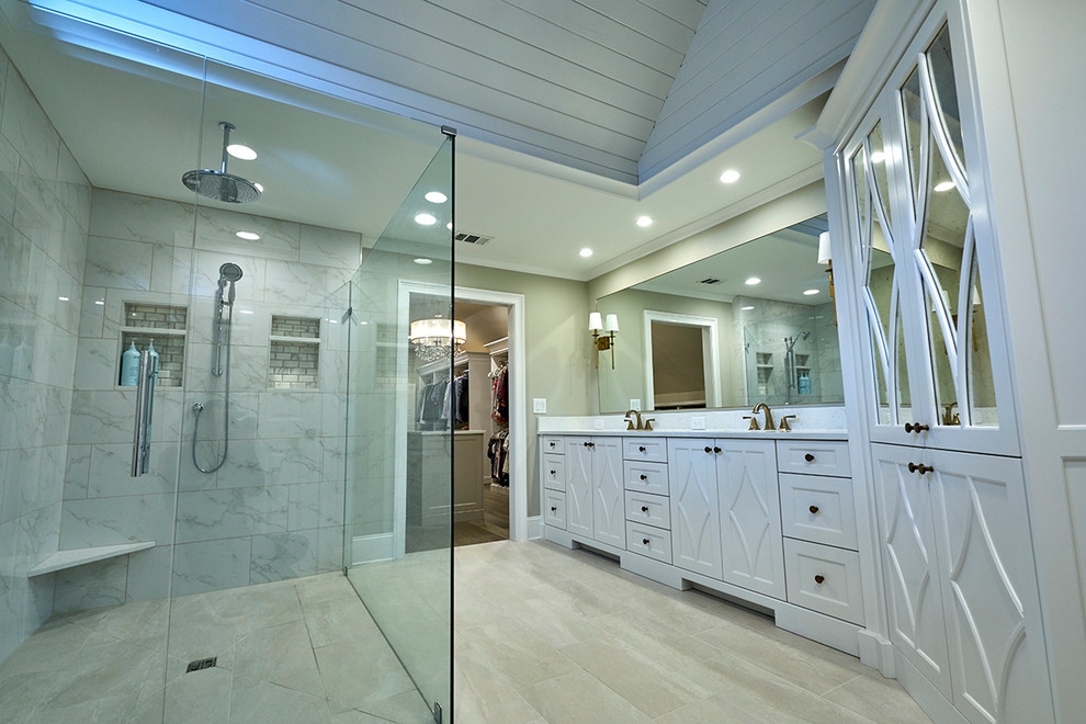 Large traditional master bathroom in Atlanta with open cabinets, white cabinets, an open shower, white tile, marble, beige floor, a hinged shower door, beige walls, porcelain floors and an undermount sink.