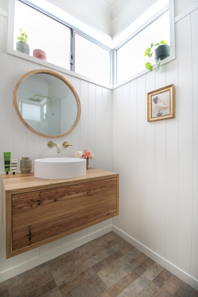 Photo of a small 3/4 bathroom in Perth with flat-panel cabinets, dark wood cabinets, an open shower, a one-piece toilet, white tile, ceramic tile, white walls, porcelain floors, a vessel sink, wood benchtops, multi-coloured floor, an open shower, a single vanity, a floating vanity and decorative wall panelling.