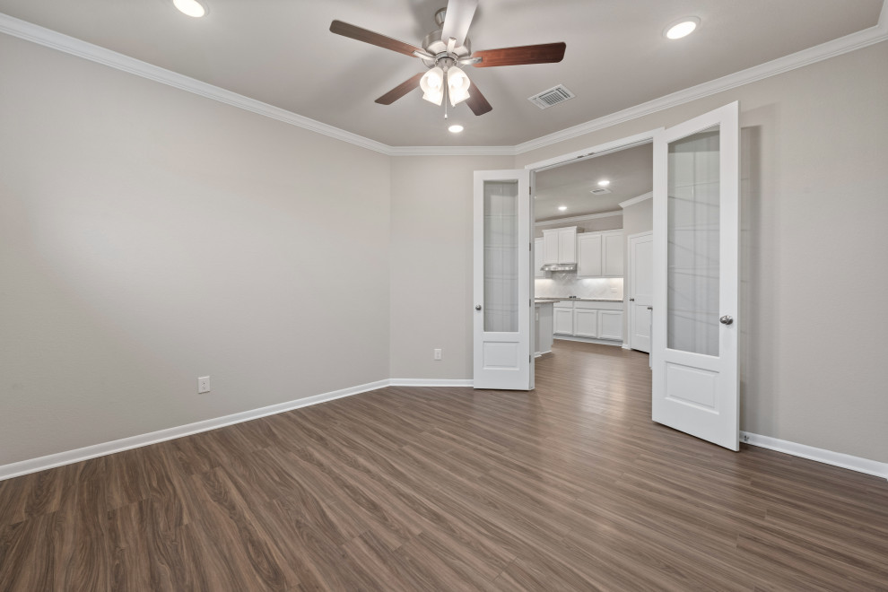 Example of a mid-sized transitional home design design in Austin