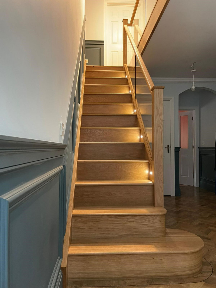 Inspiration for a large contemporary staircase in Cheshire with panelled walls.