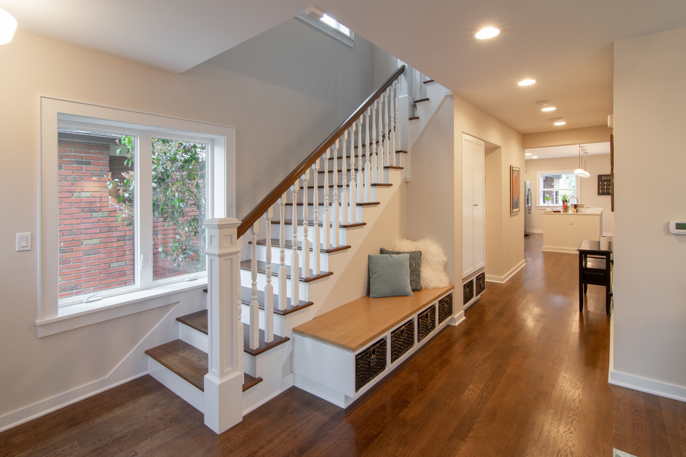 Photo of a mid-sized eclectic wood l-shaped staircase in Seattle with painted wood risers and wood railing.