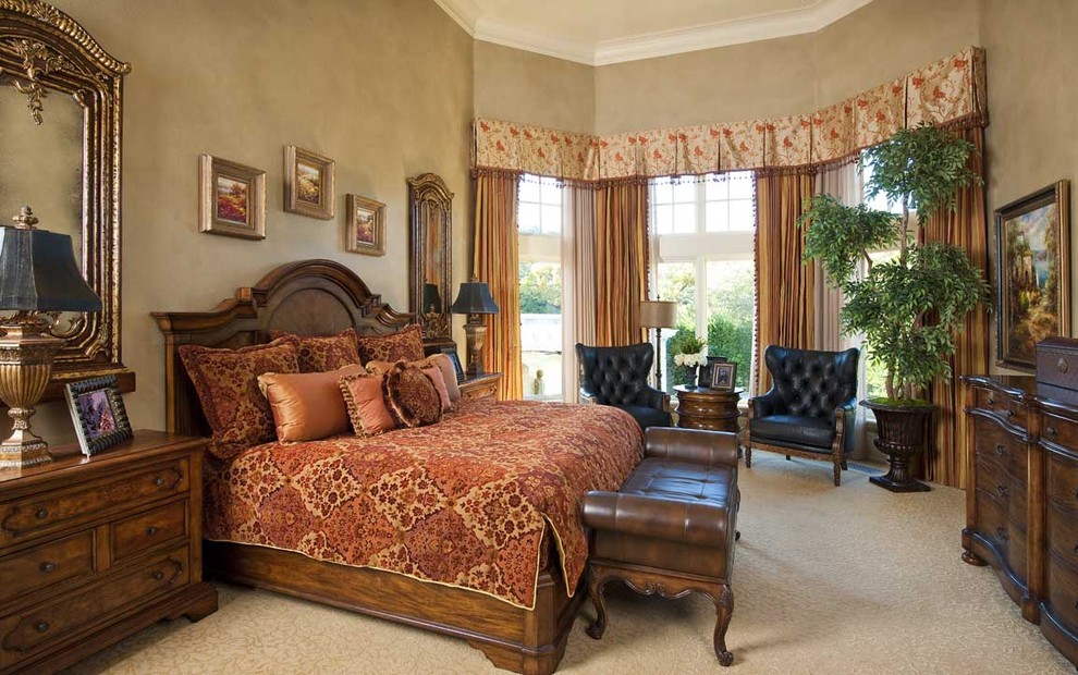 Photo of a large mediterranean master bedroom in Other with beige walls and carpet.