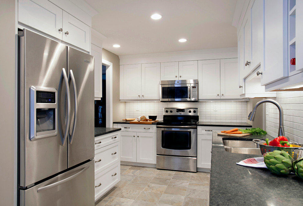 White Cabinets And White Backsplash Tile With Punches Of Steel