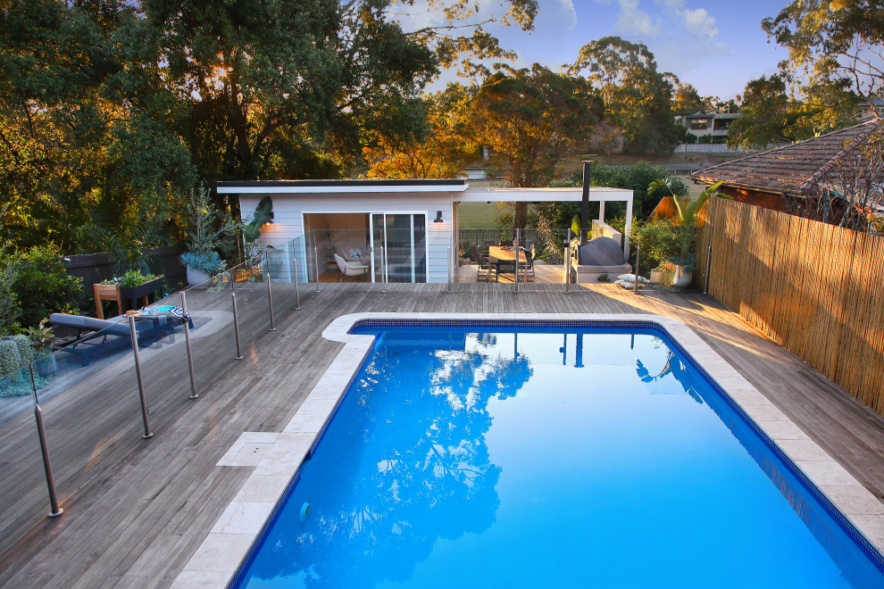 This is an example of a mid-sized contemporary backyard pool in Sydney.