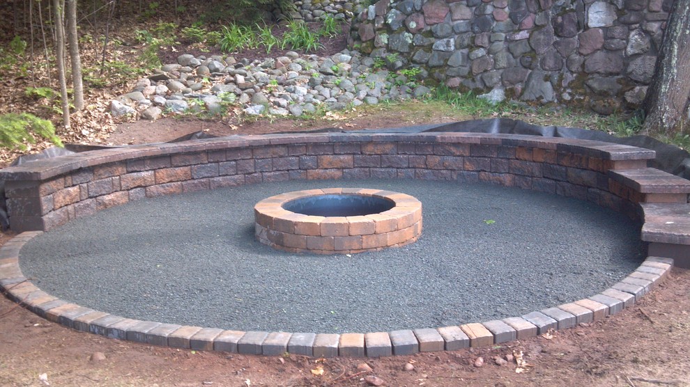 Inspiration for a rustic backyard concrete paver landscaping with a fire pit for summer.