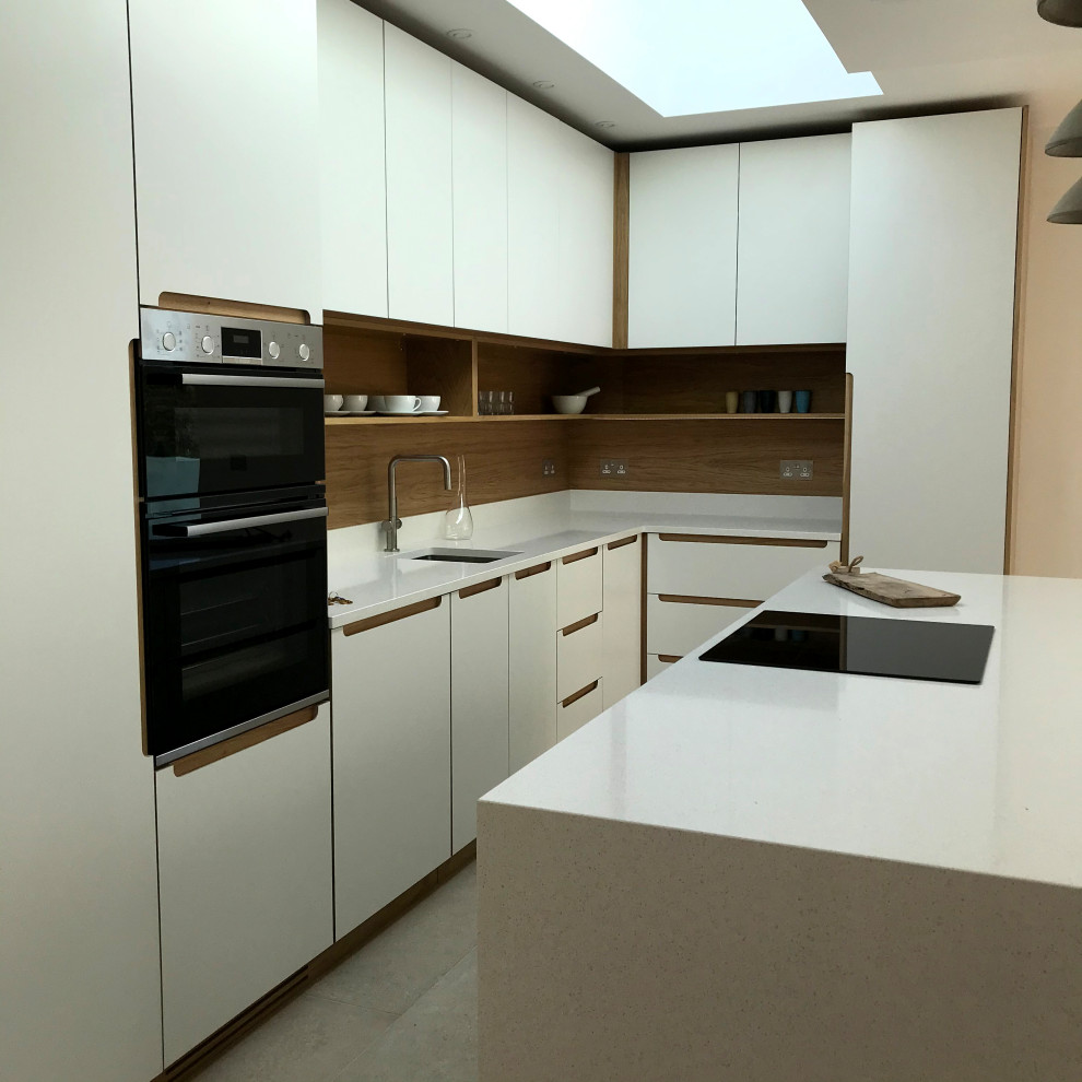 Medium sized modern l-shaped open plan kitchen in Other with an integrated sink, flat-panel cabinets, white cabinets, composite countertops, white splashback, wood splashback, stainless steel appliances, marble flooring, an island, beige floors and white worktops.