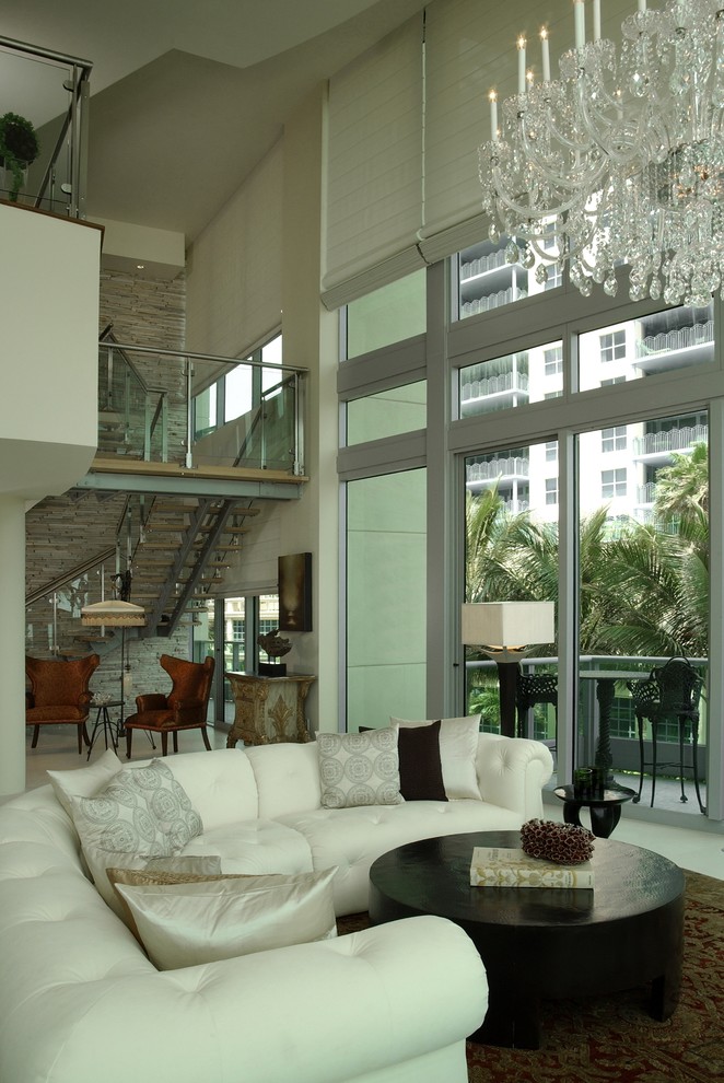 Mid-sized contemporary formal open concept living room in Miami with beige walls, no fireplace, no tv and beige floor.