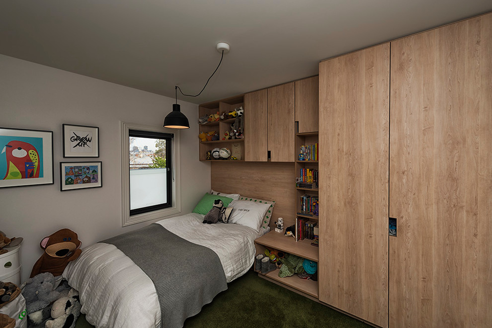 Small contemporary kids' bedroom in Melbourne with white walls for kids 4-10 years old and boys.