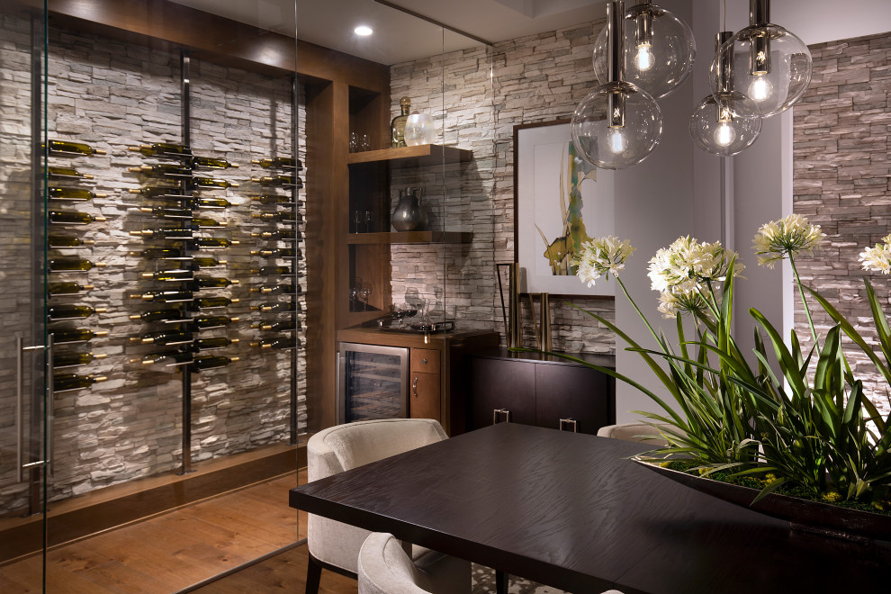 Photo of an expansive contemporary wine cellar in Nashville with medium hardwood flooring.